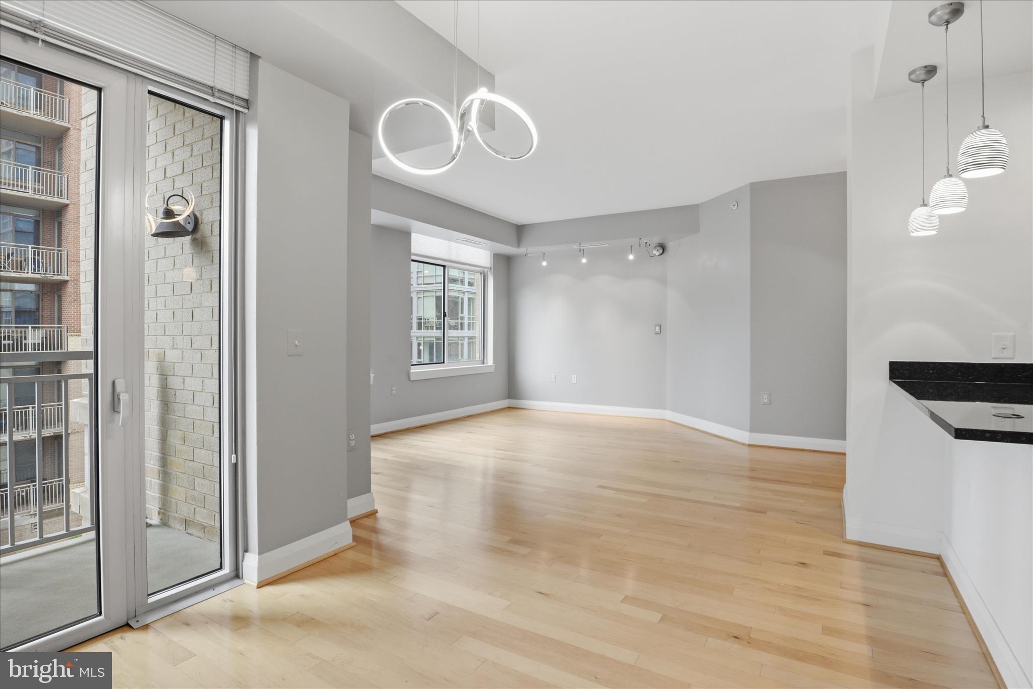 11990 Market Street, Unit 216 Reston, VA 20190 - Photo 24 of 41 a view of empty room with wooden floor and fan