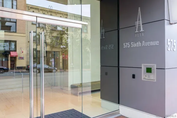 a bathroom with a glass shower door