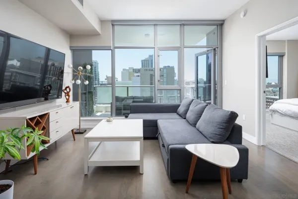 a living room with furniture and a flat screen tv