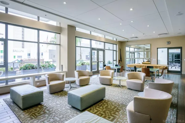 a living room with furniture and a large window