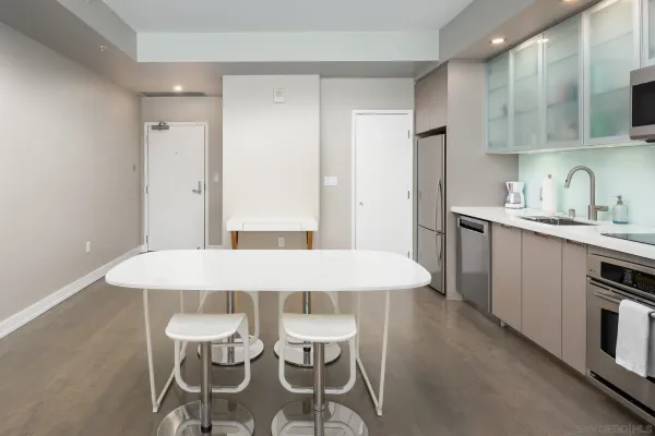a dining table with chairs and wooden floor