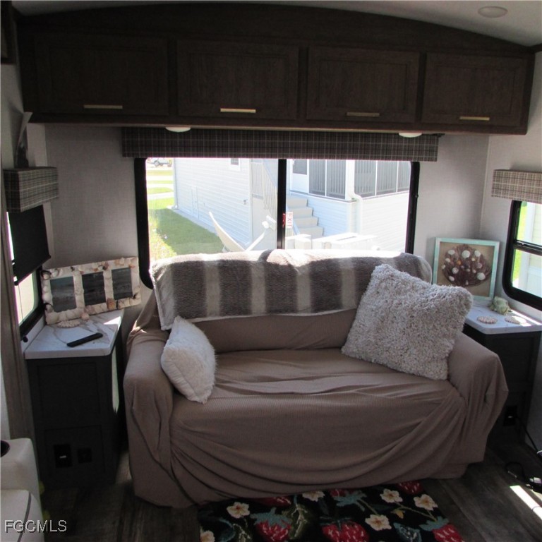 19681-313 Summerlin Road Fort Myers, FL 33908 - Photo 15 of 40 a living room with furniture and a window