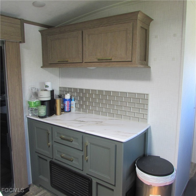 19681-313 Summerlin Road Fort Myers, FL 33908 - Photo 18 of 40 a bathroom with a granite countertop sink and a toilet