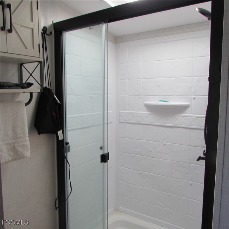 19681-313 Summerlin Road Fort Myers, FL 33908 - Photo 20 of 40 a bathroom with a shower