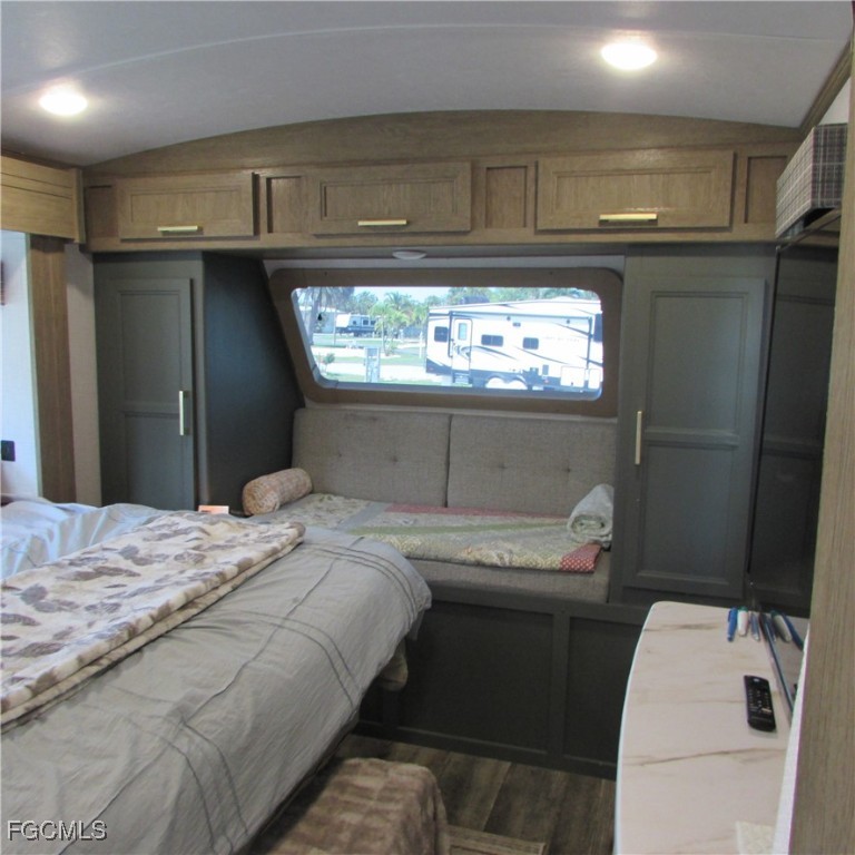 19681-313 Summerlin Road Fort Myers, FL 33908 - Photo 23 of 40 a bedroom with a bed and a window