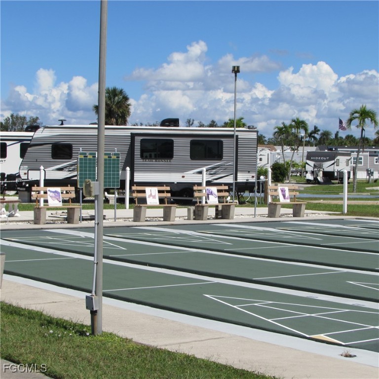 19681-313 Summerlin Road Fort Myers, FL 33908 - Photo 34 of 40 a view of house with a big yard and potted plants