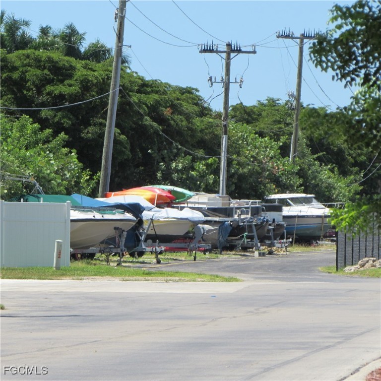 19681-313 Summerlin Road Fort Myers, FL 33908 - Photo 39 of 40 a backyard of a house with yard and outdoor seating