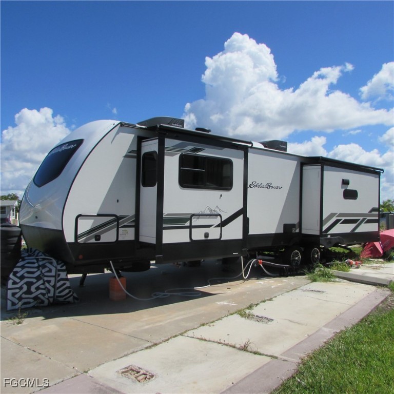 19681-313 Summerlin Road Fort Myers, FL 33908 - Photo 4 of 40 a front view of a house with a yard