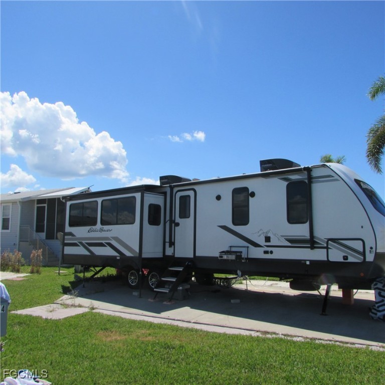 19681-313 Summerlin Road Fort Myers, FL 33908 - Photo 5 of 40 a front view of house with a garden