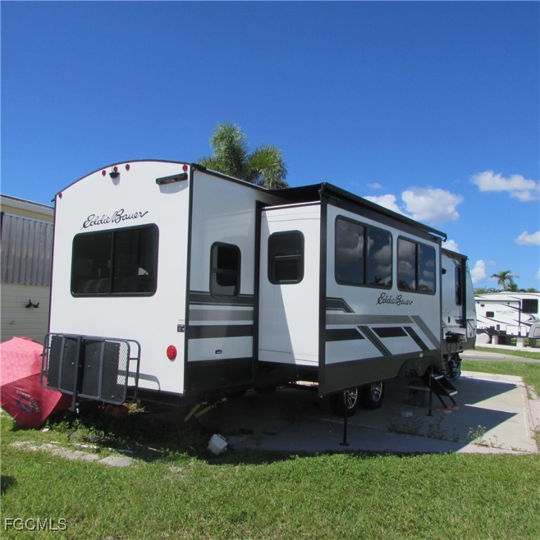 19681-313 Summerlin Road Fort Myers, FL 33908 - Photo 7 of 40 a front view of a house with backyard