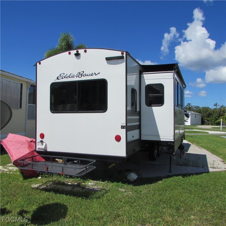 19681-313 Summerlin Road Fort Myers, FL 33908 - Photo 8 of 40 a front view of a house with a yard