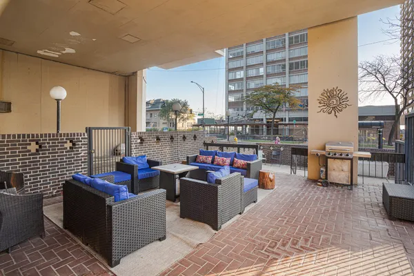 a outdoor living space with furniture and a potted plant