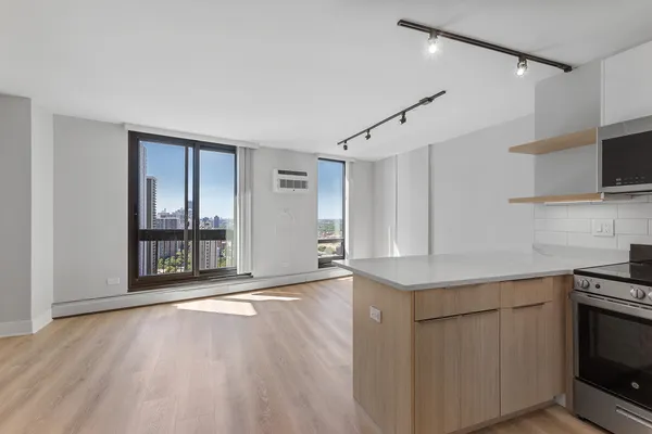 a view of a kitchen with a sink and dishwasher wooden floor