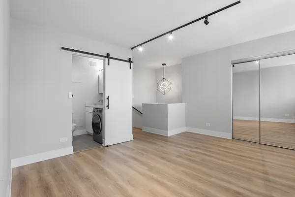 a view of a storage & utility room with a sink