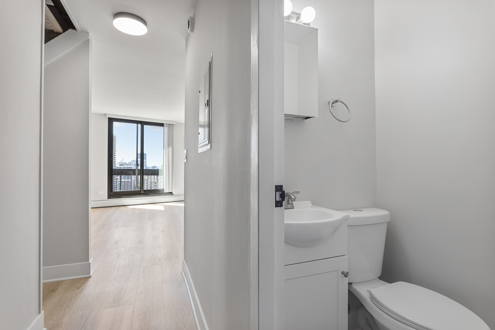 6166 North Sheridan Road, Unit 28J Chicago, IL 60660 - Photo 8 of 21 a bathroom with a sink a toilet and shower