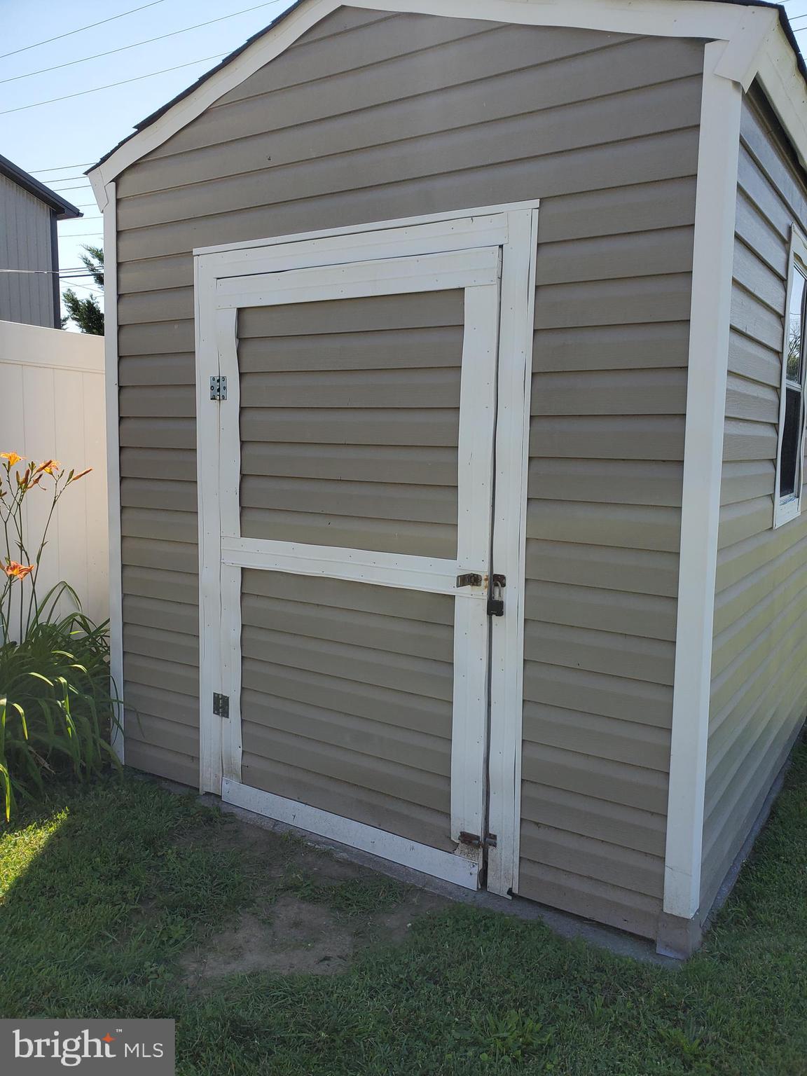 64 Riverside Road Essex, MD 21221 - Photo 7 of 30 Storage Shed with lawn mower