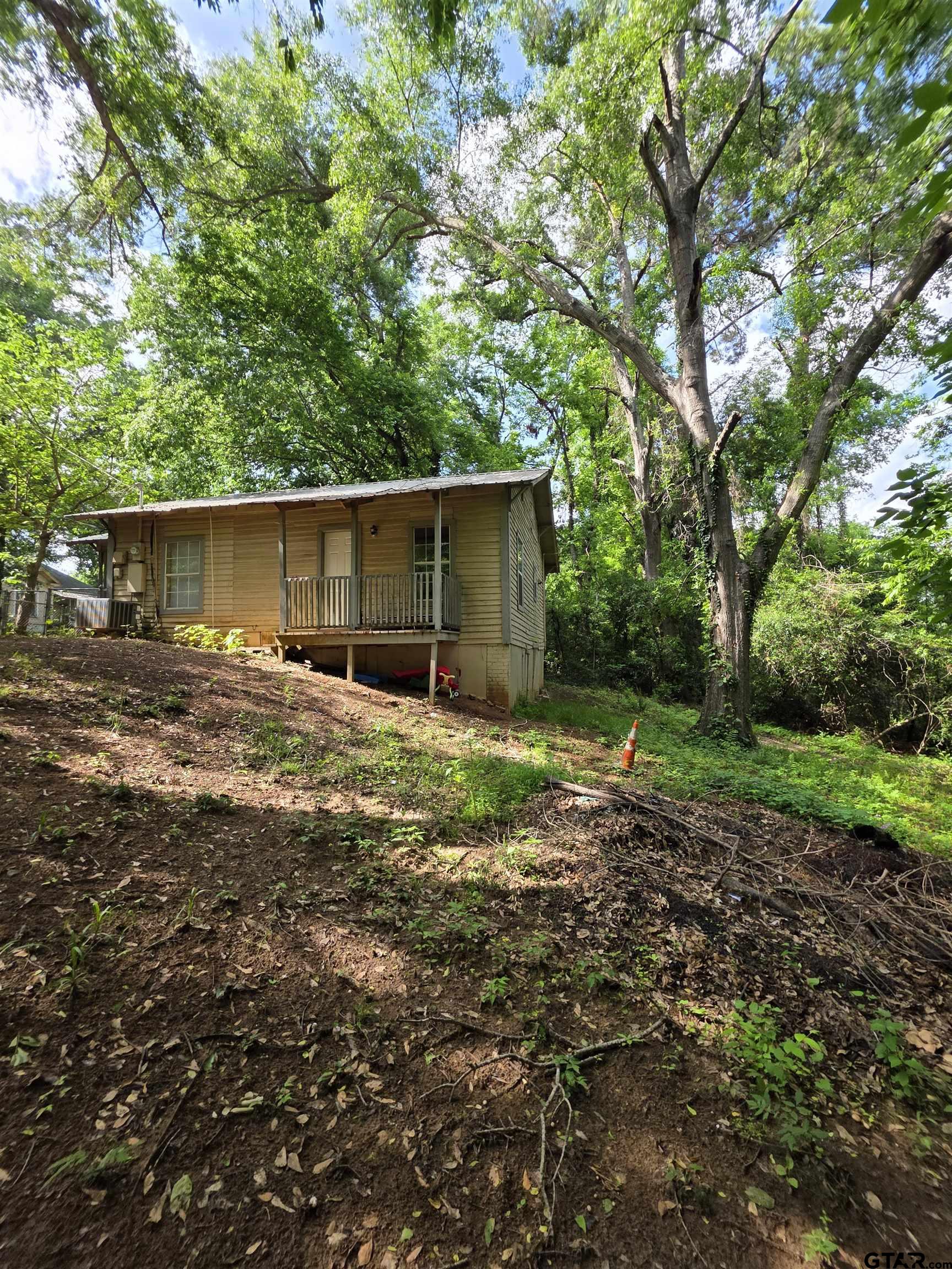 316 North Hospital Street Rusk, TX 75785 - Photo 6 of 21 a backyard of a house with lots of green space