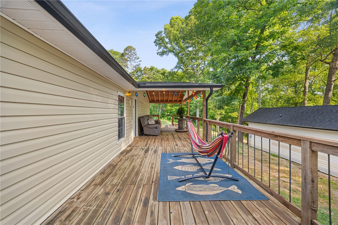 217 Old River Road Pelzer, SC 29669 - Photo 20 of 30 An inviting rear deck offers an idyllic retreat amidst lush surroundings.