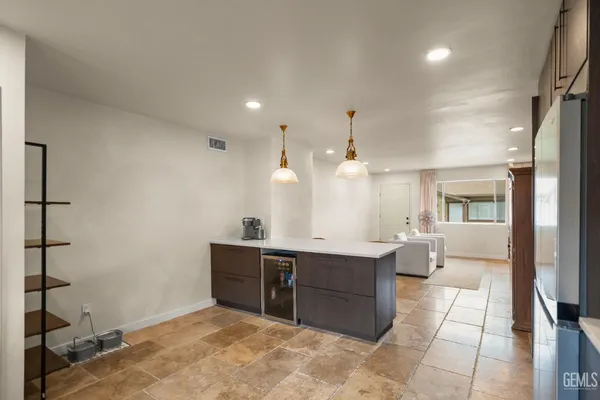 a utility room with cabinets washer and dryer