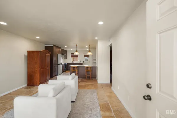 a view of kitchen with sink and microwave