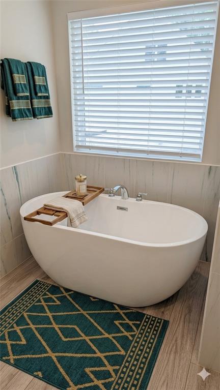 4830 Spangle Court Cumming, GA 30028 - Photo 12 of 18 a bathroom with a bathtub and a sink
