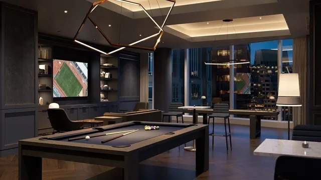 a room with furniture pool table table and chairs