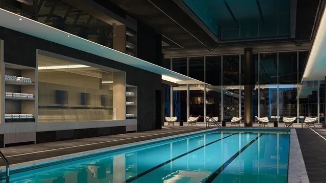 a view of a living room with furniture and chandelier