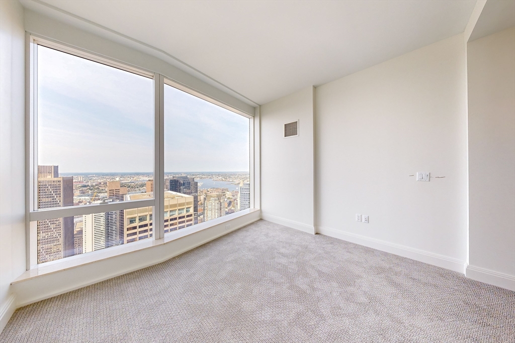 240 Devonshire Street, Unit 5614 Boston, MA 02110 - Photo 7 of 41 wooden floor in an empty room with a window