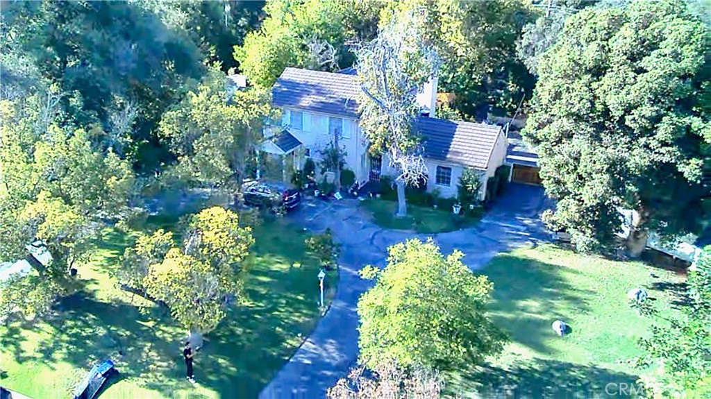 an aerial view of a house with a garden
