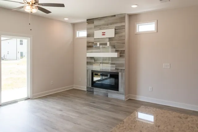 wooden floor in an empty room and a kitchen