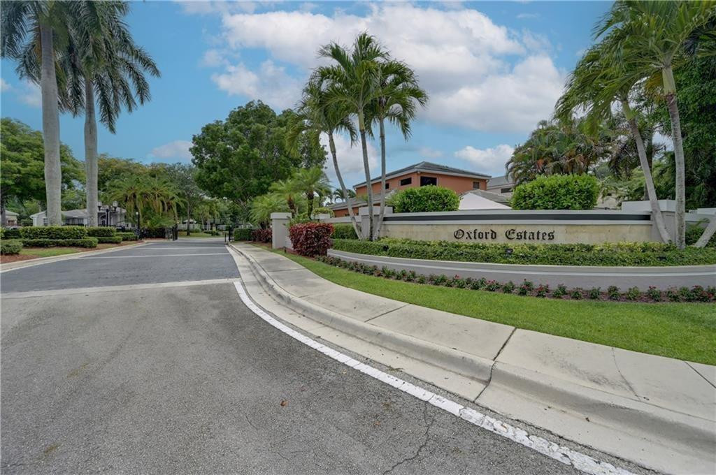 8171 Hampton Wood Drive Boca Raton, FL 33433 - Photo 43 of 56 a view of a garden with a cars park