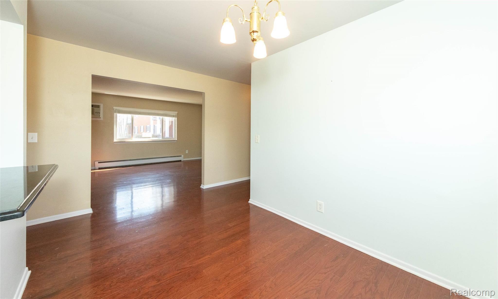 1095 Tienken Court, Unit 101 Rochester, MI 48306 - Photo 10 of 19 View from Dining Room to Living Room
