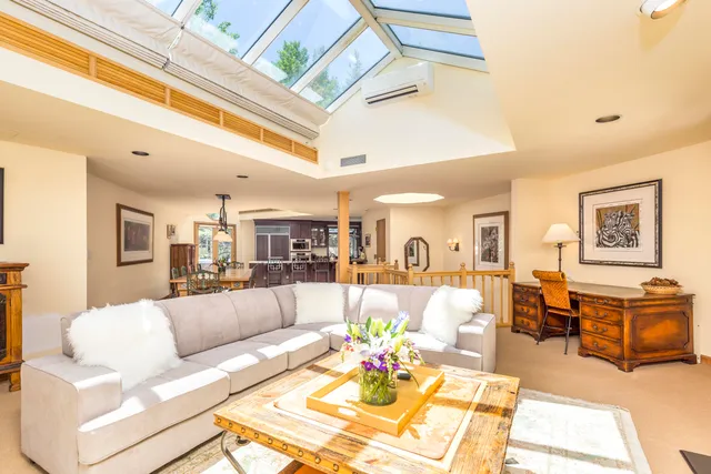 a view of a living room and dining room