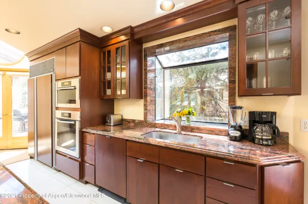 a dining room with a table and chairs