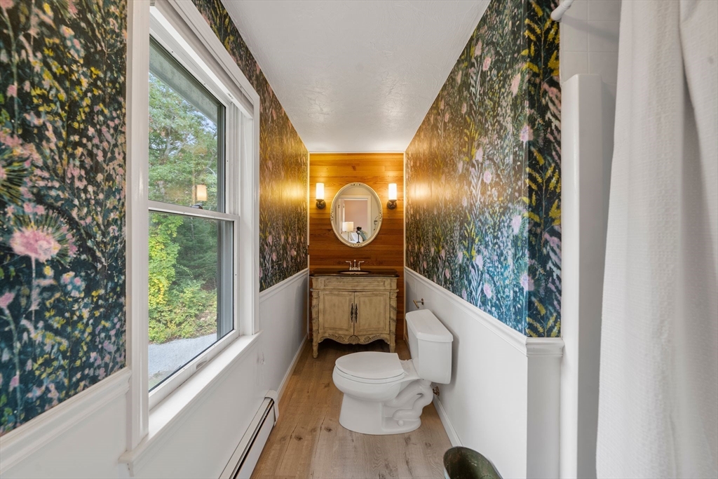 5 Cardinal Road Sandwich, MA 02563 - Photo 12 of 41 a bathroom with a toilet a sink and a mirror