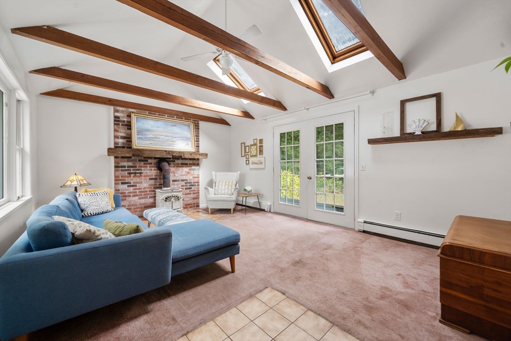 5 Cardinal Road Sandwich, MA 02563 - Photo 13 of 41 a living room with furniture and a fireplace
