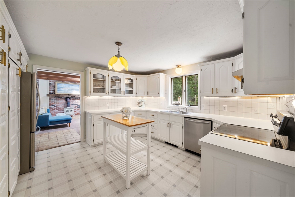 5 Cardinal Road Sandwich, MA 02563 - Photo 16 of 41 a kitchen with a sink and a stove top oven