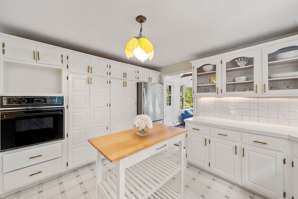 5 Cardinal Road Sandwich, MA 02563 - Photo 17 of 41 a kitchen with stainless steel appliances granite countertop a stove a sink and a microwave