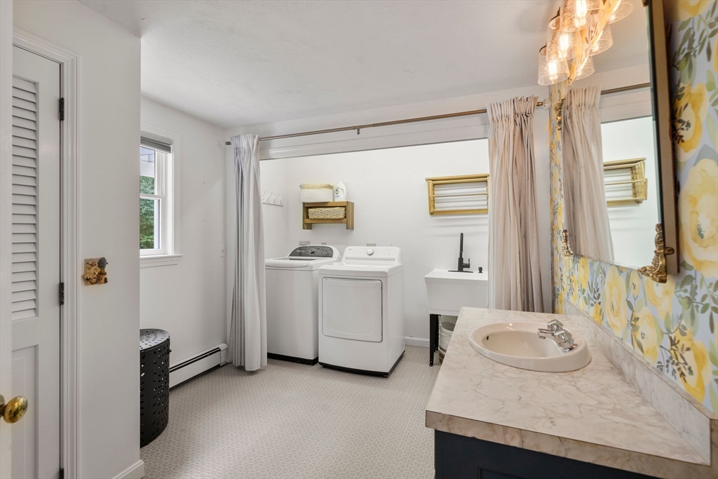 5 Cardinal Road Sandwich, MA 02563 - Photo 21 of 41 a bathroom with a granite countertop sink and a mirror
