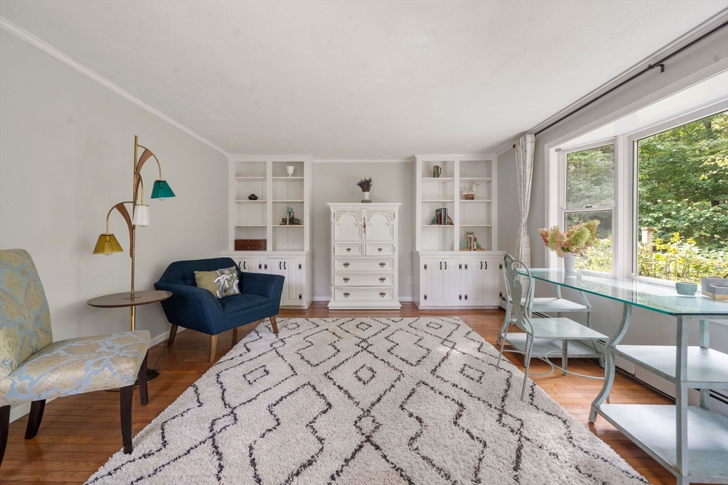 5 Cardinal Road Sandwich, MA 02563 - Photo 27 of 41 a living room with furniture and a large window