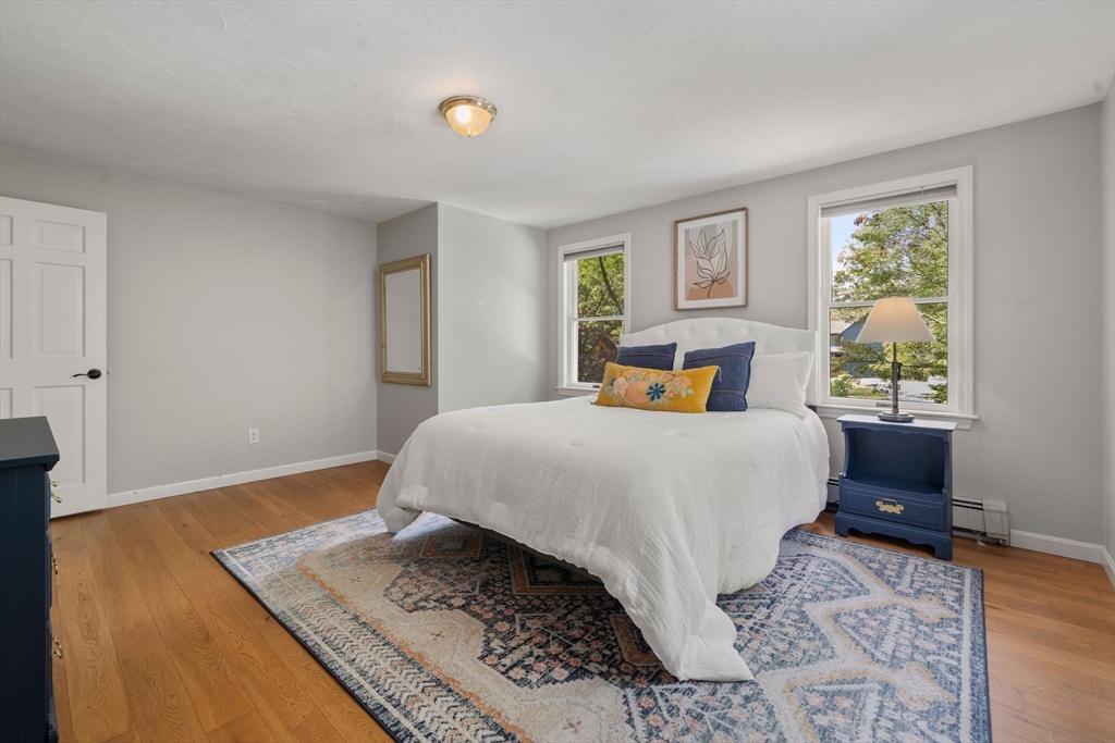 5 Cardinal Road Sandwich, MA 02563 - Photo 3 of 41 a bedroom with a bed and wooden floor