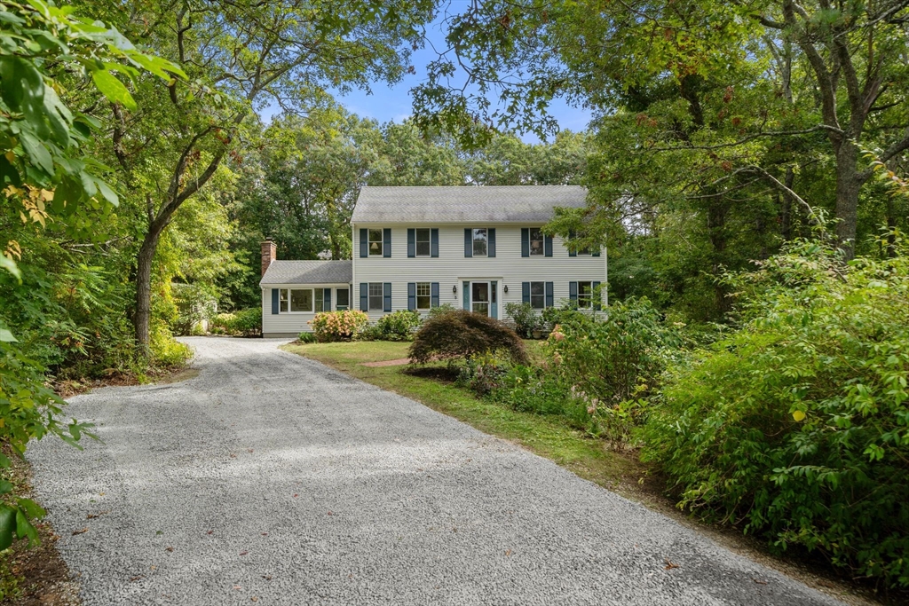 5 Cardinal Road Sandwich, MA 02563 - Photo 36 of 41 a view of a house with a yard and potted plants