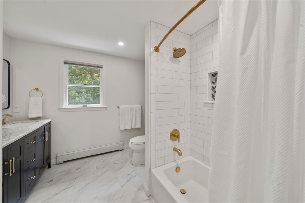 5 Cardinal Road Sandwich, MA 02563 - Photo 8 of 41 a bathroom with a sink a toilet and shower