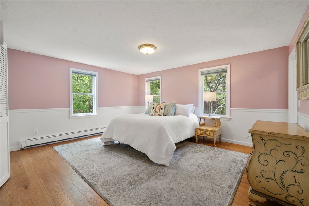 5 Cardinal Road Sandwich, MA 02563 - Photo 10 of 41 a spacious bedroom with a bed and wooden floor