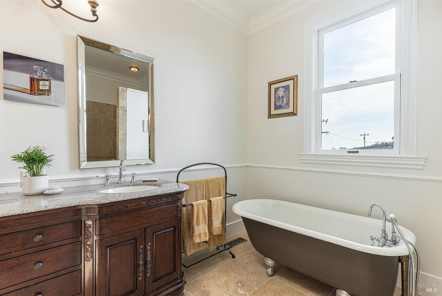 1730 Milton Road Napa, CA 94559 - Photo 53 of 77 a bathroom with a tub sink and mirror