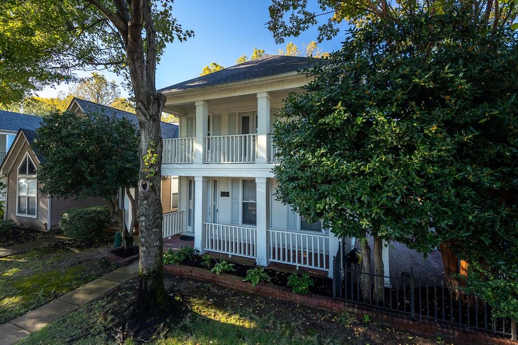 1227 Isle View Drive Memphis, TN 38103 - Photo 35 of 37 a view of a house with a yard and potted plants