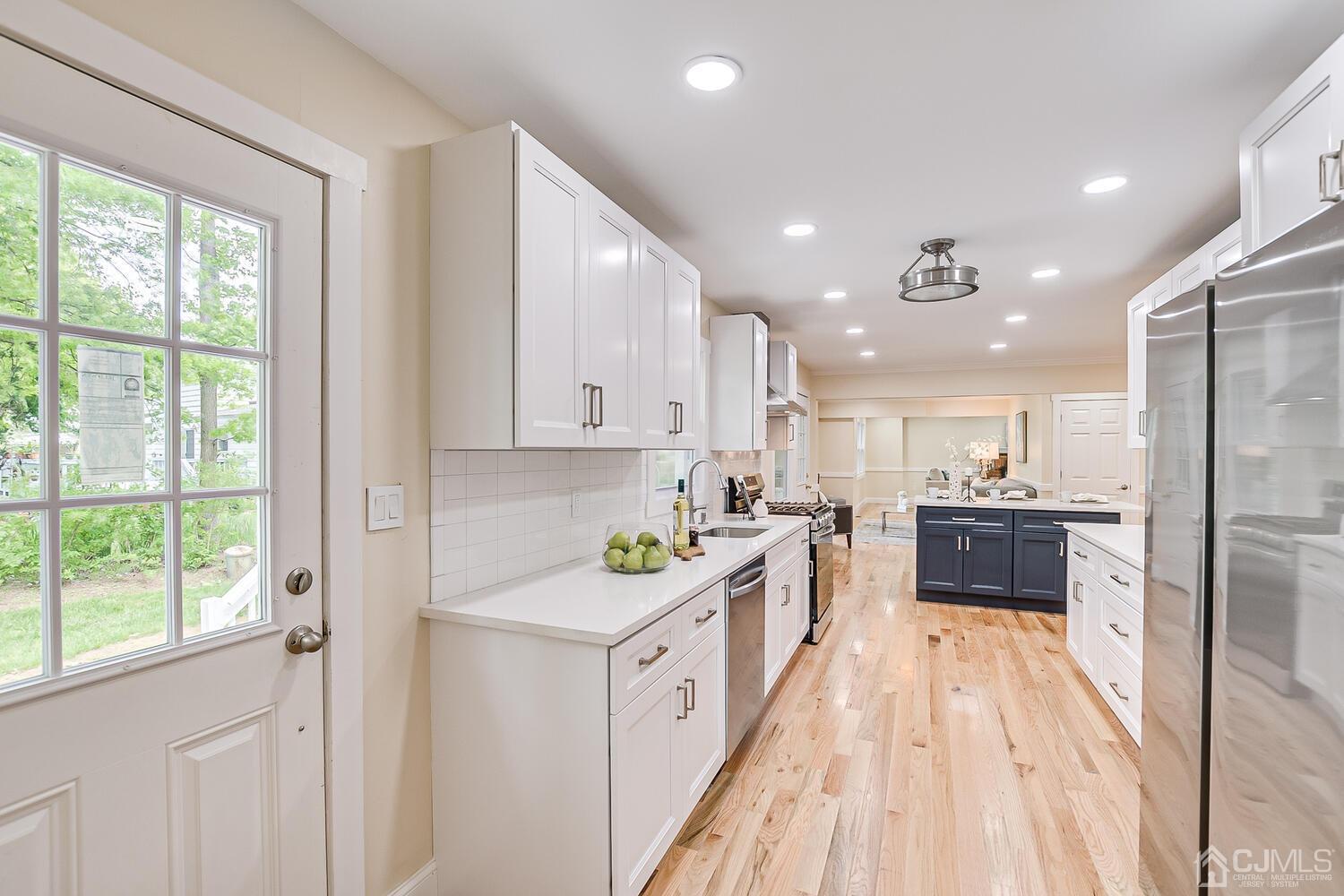2 Devon Road Edison, NJ 08820 - Photo 37 of 69 a large white kitchen with a large window