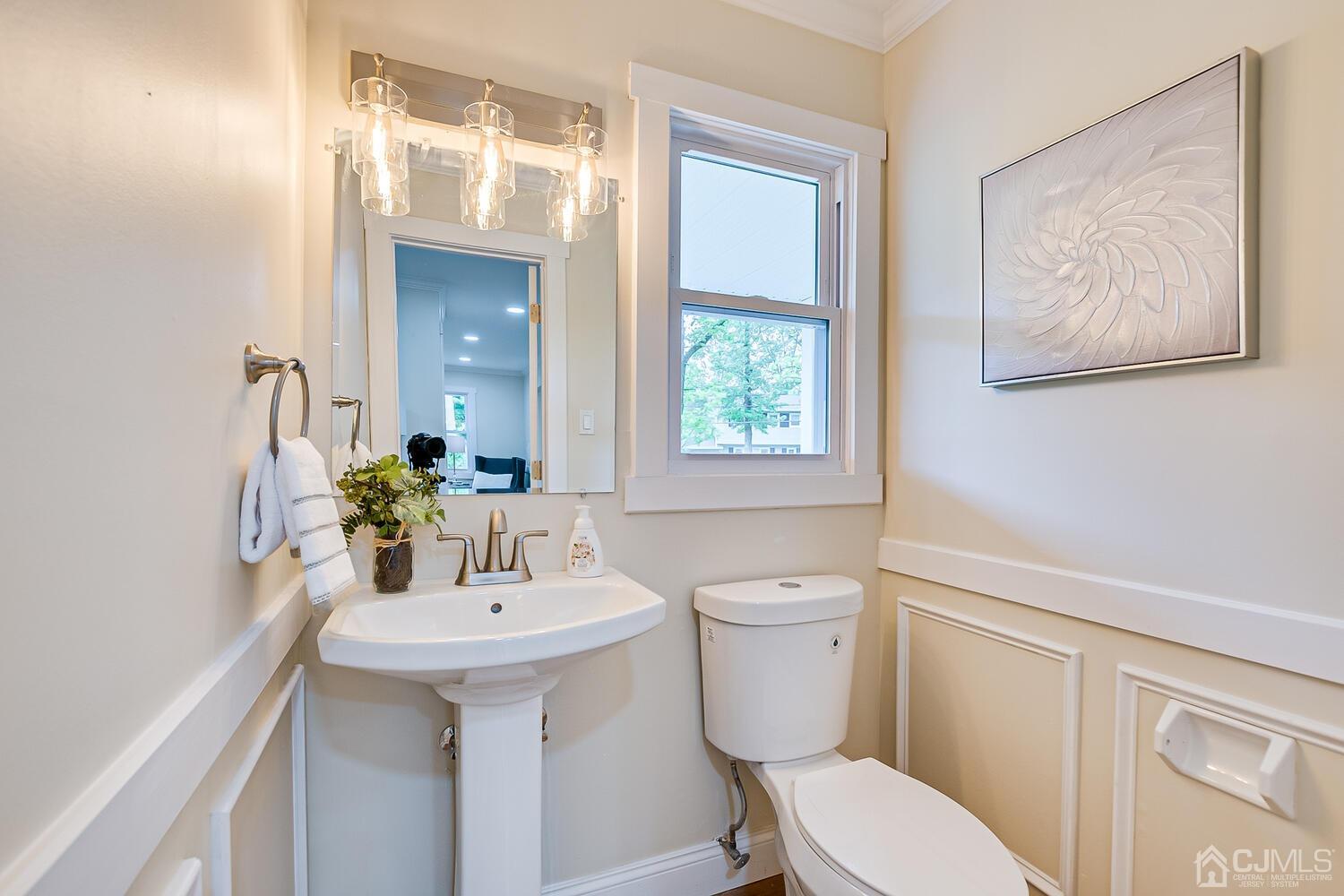 2 Devon Road Edison, NJ 08820 - Photo 41 of 69 a bathroom with a toilet a sink and a mirror