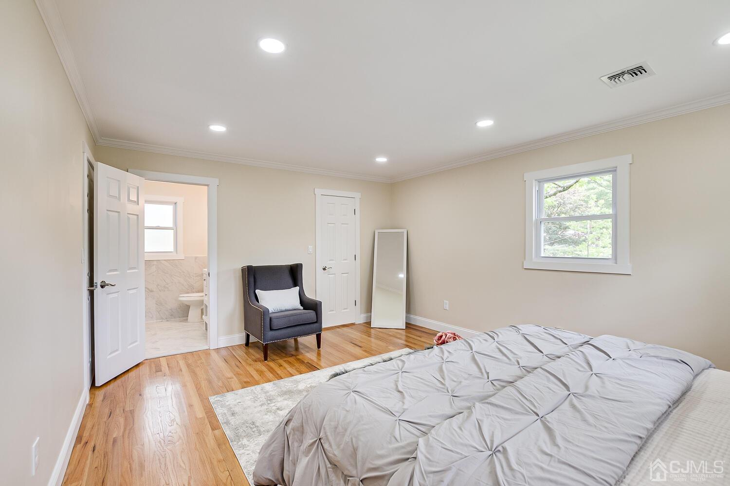 2 Devon Road Edison, NJ 08820 - Photo 45 of 69 a bedroom with a bed and wooden floor