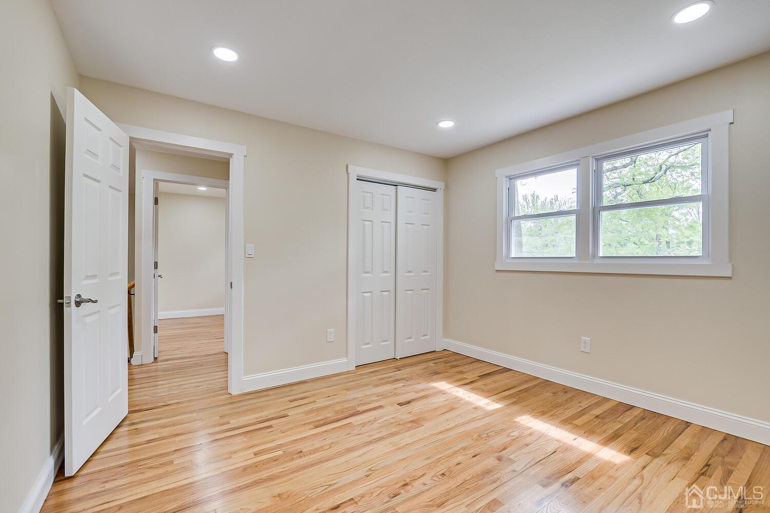 2 Devon Road Edison, NJ 08820 - Photo 53 of 69 wooden floor in an empty room with a window